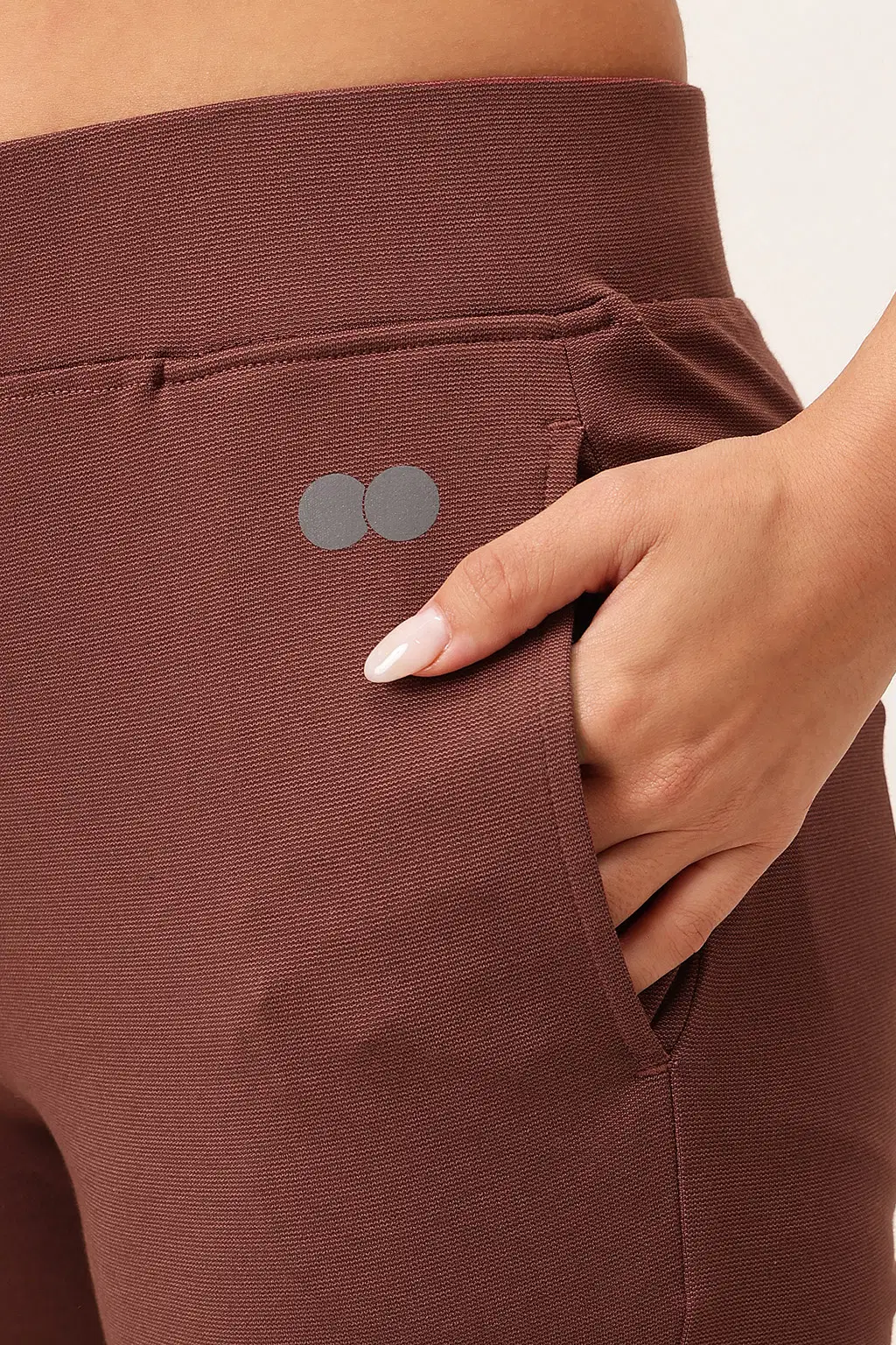 clovia-picture-comfort-fit-high-rise-flared-yoga-pants-in-brown-with-side-pockets-342533.webp