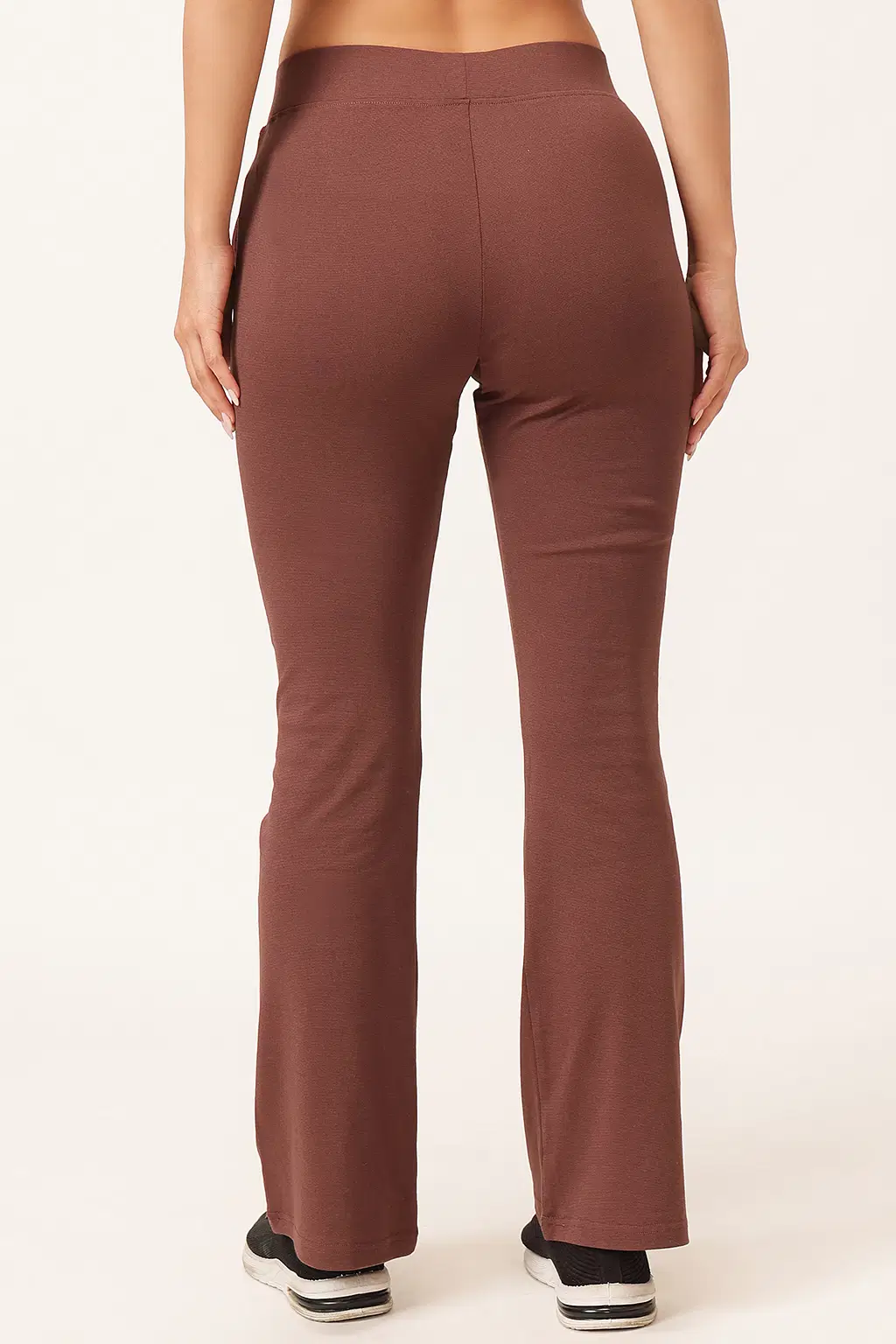 clovia-picture-comfort-fit-high-rise-flared-yoga-pants-in-brown-with-side-pockets-518985.webp